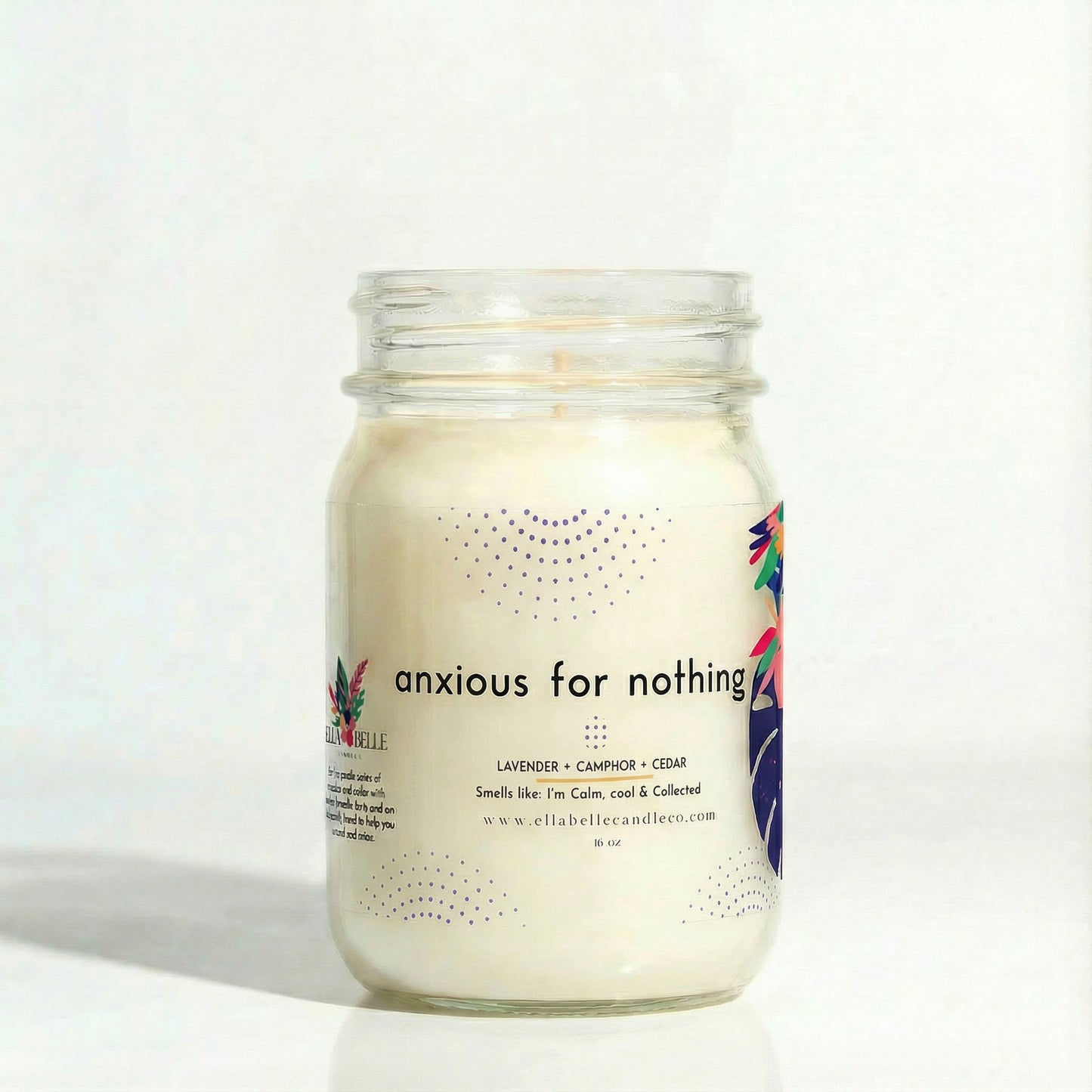 Candle in a mason jar labeled 'anxious for nothing' on a clear background