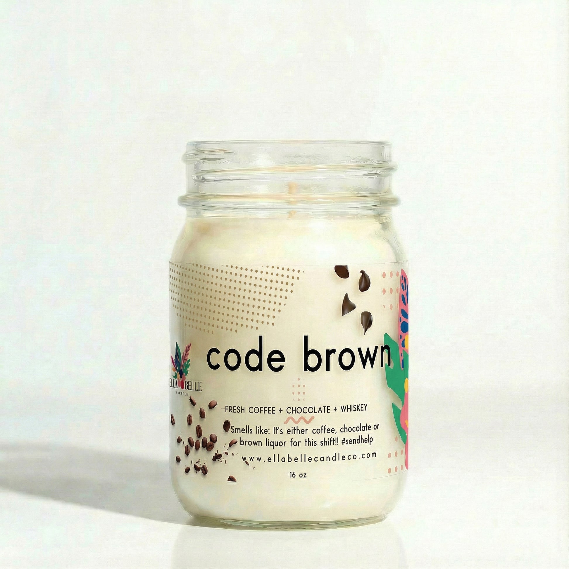 Mason jar candle labeled 'code brown' with decorative elements on a clear background