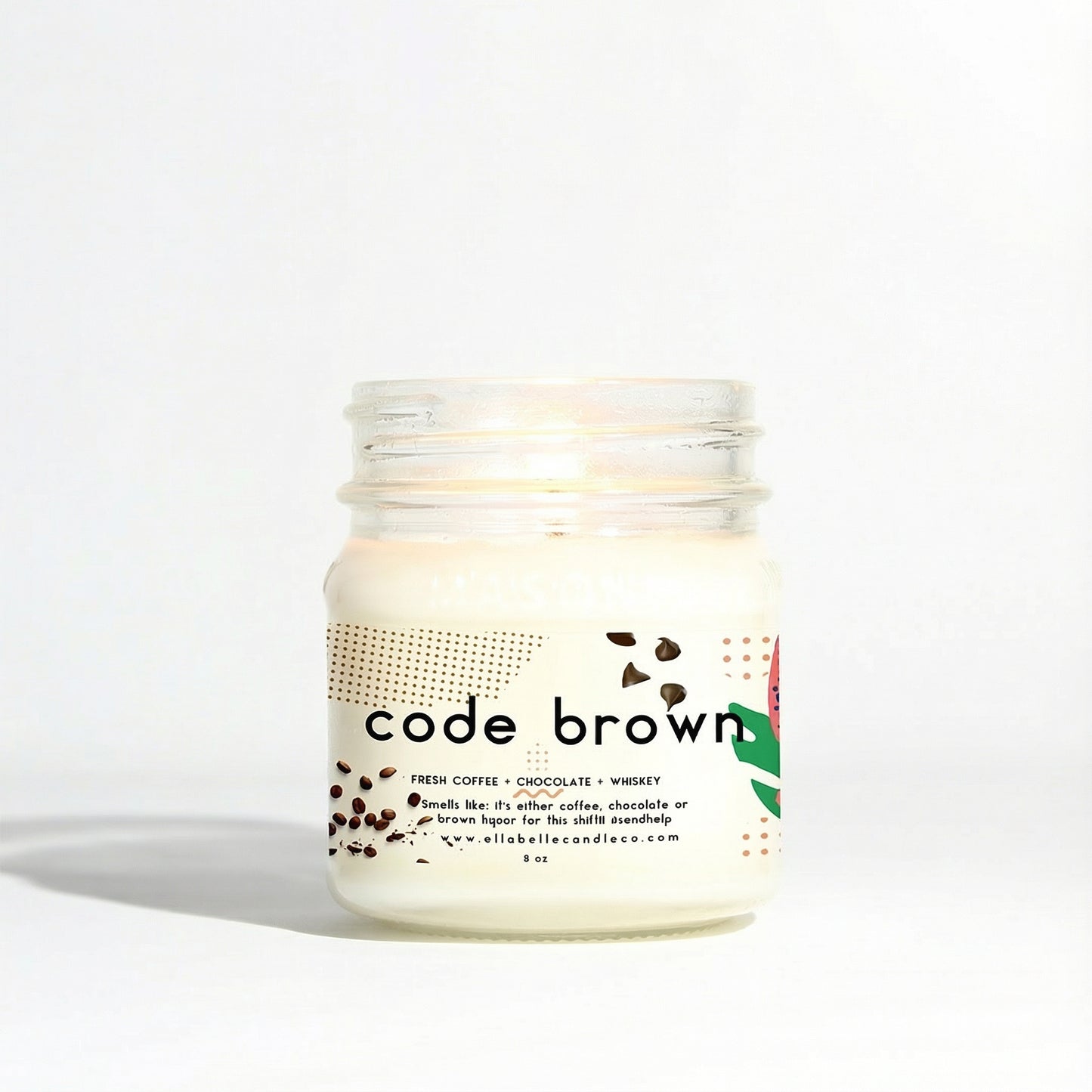 Mason jar candle labeled 'code brown' with decorative elements on a clear background