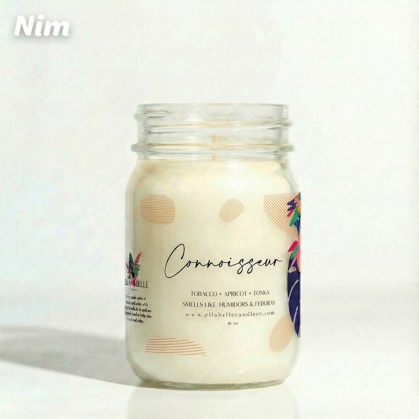 Candle jar labeled 'Connoisseur' with a decorative label on a white background