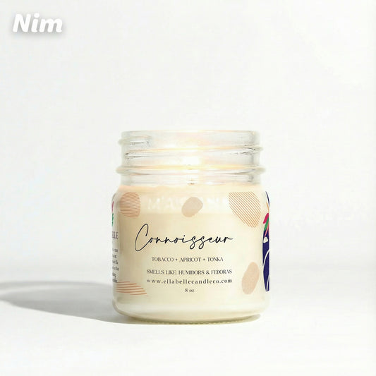 Candle jar labeled 'Connoisseur' with a decorative label on a white background
