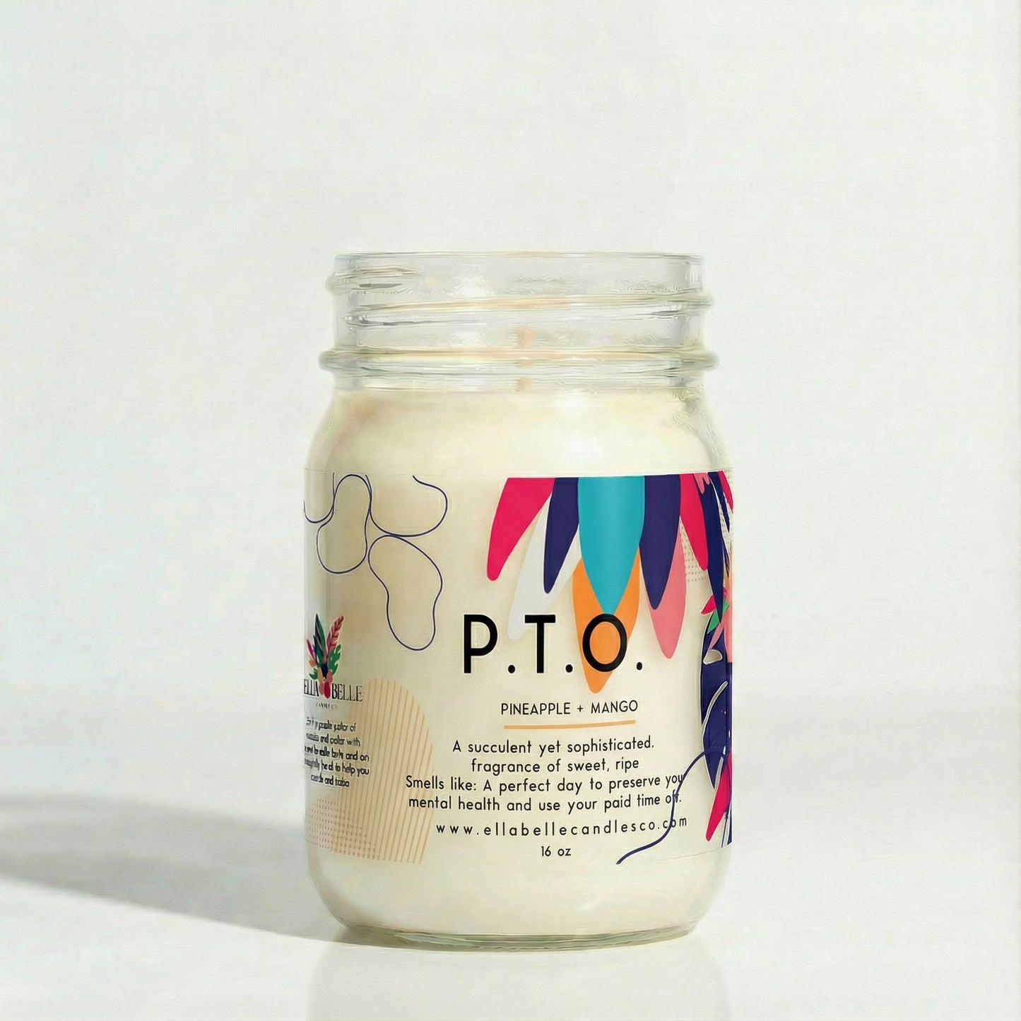 Candle in a glass jar labeled P.T.O. with a colorful label on a white background