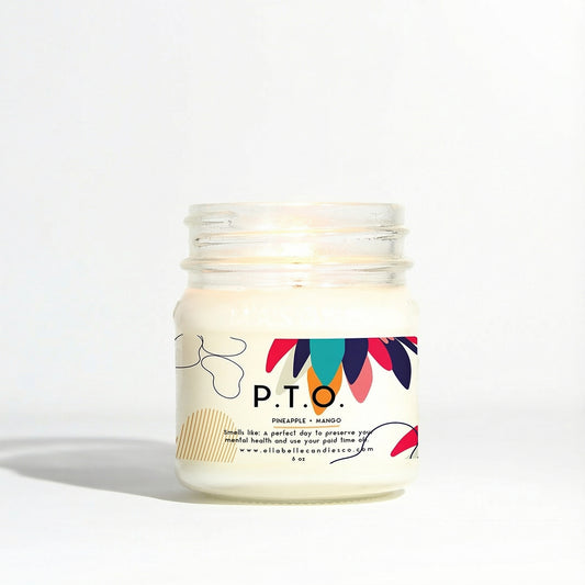 Candle in a glass jar labeled P.T.O. with a colorful label on a white background