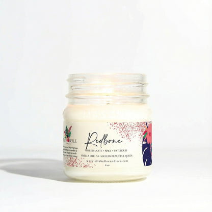 Candle jar with a decorative label on a white background