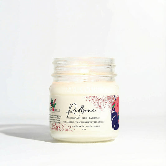 Candle jar with a decorative label on a white background