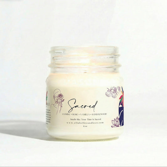 Candle jar labeled 'Sacred' on a white background