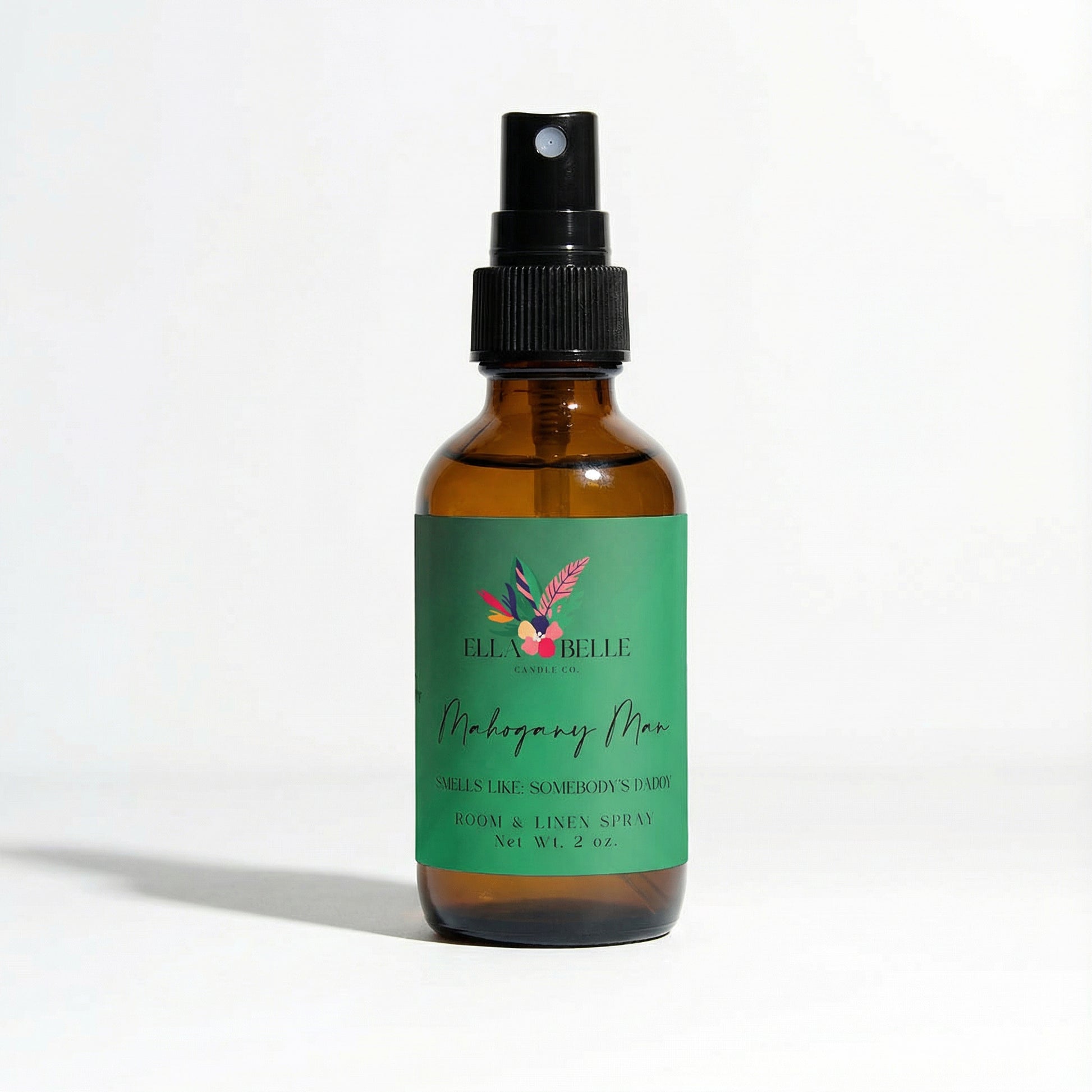 Brown spray bottle with green label on a white background