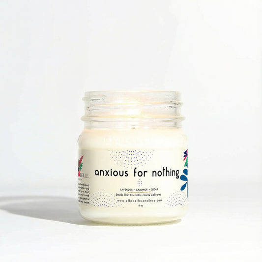 Candle jar labeled 'anxious for nothing' on a clear background