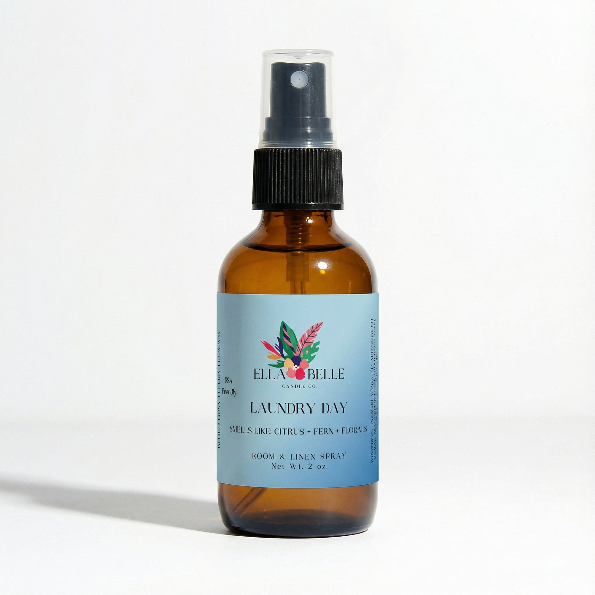Brown spray bottle with a blue label on a white background